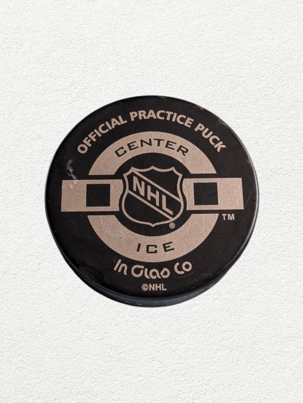 Official NHL Center Ice Practice Hockey Puck - Black